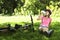 Teenage girl resting in a park with a bicycle