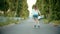 A teenage girl in rollerblades skating on the empty road