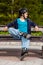 Teenage girl rollerblading in city park
