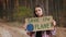 Teenage girl with Save the Planet poster