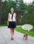 Teenage girl in school uniform walking with hungry dog yorkshire