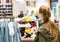 Teenage girl shopping for clothes inside Clothing store