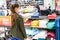 Teenage girl shopping for clothes inside Clothing store