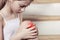 Teenage girl sits stairs holding hands knee soft focus