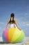 Teenage Girl Sitting On Beach Ball