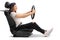 Teenage girl sitting in car seat and holding steering wheel