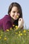 Teenage Girl Sitting In Summer Meadow