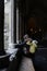 Teenage girl sitting by a window at Westminster Abbey