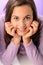 Teenage girl smiling on purple close-up portrait