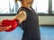 Teenage girl in sports clothes holding a dislocated shoulder on training