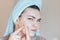 Teenage girl squeezing her pimples, removing pimple from her face. Woman skin care concept photos of ugly problem skin girl on