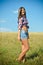 Teenage girl on summer field