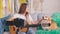 A Teenage Girl is Talking, Filming Her Video Blog, Conducting Distance Learning to Play the Guitar. An Attractive Video