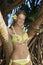 Teenage girl by a tropical tree in hawaii