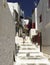 Teenage Girl walking the narrow street of Mykonos