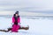 Teenage girl walking on sea shore Narva Estonia