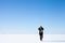 Teenage girl walks along endless snowfield