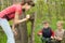 Teenage girl watching two young boys at play