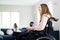 Teenage Girl In Wheelchair Watching Television With Freinds At Home