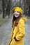 Teenage girl in a yellow coat and beret portrait autumn season