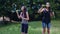 Teenage girls blowing soap bubbles in summer time