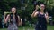 Teenage girls blowing soap bubbles in summer time