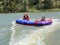 Teenage girls in donuts.(water raft)