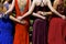 Teenage girls dressed in colorful gowns