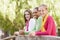 Teenage Girls Leaning On Wooden Railing