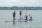 Teenage girls learning to paddle board