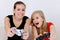 Teenage girls playing playstation