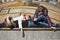 Teenage girls relaxing on a city street