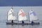 Teenage girls sailing boats race