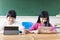 teenage girls student watching the tablet in classroom