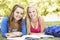 Teenage Girls Studying In Park