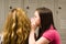 Teenage girls telling secrets