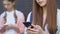 Teenage girls using cellphones, ignoring live communication, gadget addiction