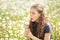 teenage girls on a walk with their sister and dog in a summer field with dandelions sunny day