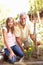 Teenage Granddaughter And Grandfather Relaxing In