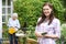 Teenage Granddaughter Helping Grandmother In Garden