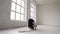 Teenage gymnast girl with the ball in his hands performs acrobatic moves at sport indoor in the white background near