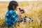 Teenage happy boy playing with rat pet outdoor