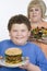 Teenage Holding Plate Of Hamburger