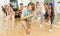Teenage krump dancer dancing with teenagers in choreographic studio