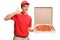 Teenage pizza delivery boy holding a pizza box and making a call