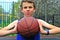 Teenage playing basketball on the court