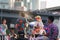 Teenage plays water with his friend during Songkran