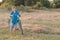 Teenage with raised thumb gesture in field