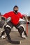 Teenage road hockey goalie outside on street