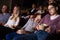 Teenage siblings sleeping in cinema during boring movie